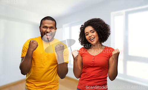 Image of happy african american couple celebrating success