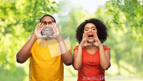 Image of happy african american couple calling