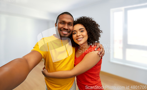 Image of happy smiling african american couple takes selfie