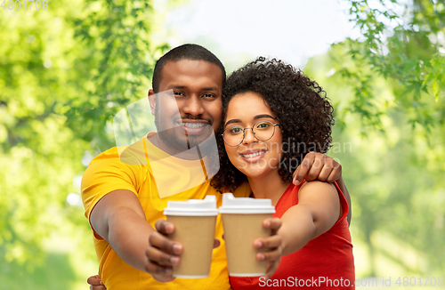 Image of happy african american couple with coffee cups