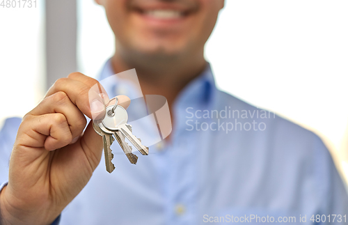 Image of close up of smiling man holding house keys