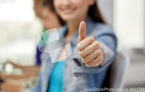 Image of close up of happy student girl showing thumbs up