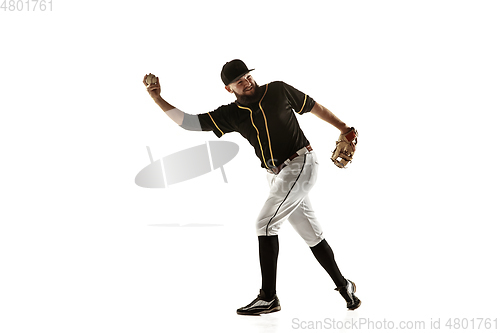 Image of Baseball player, pitcher in a black uniform practicing on a white background.