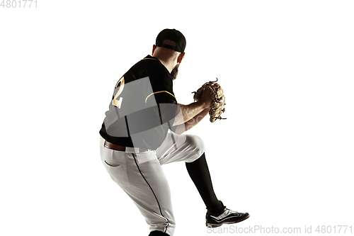 Image of Baseball player, pitcher in a black uniform practicing on a white background.