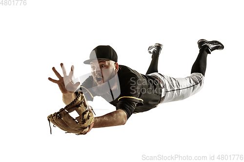 Image of Baseball player, pitcher in a black uniform practicing on a white background.