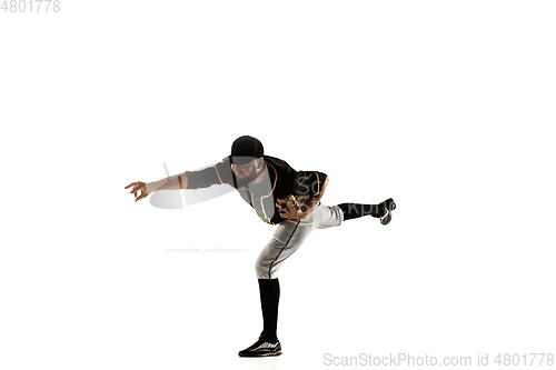 Image of Baseball player, pitcher in a black uniform practicing on a white background.