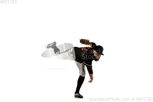 Image of Baseball player, pitcher in a black uniform practicing on a white background.