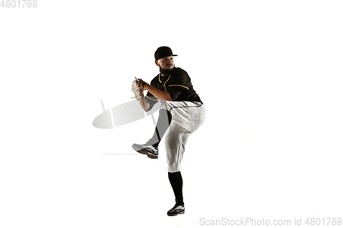 Image of Baseball player, pitcher in a black uniform practicing on a white background.