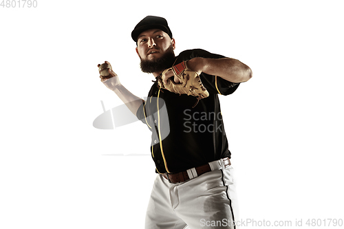 Image of Baseball player, pitcher in a black uniform practicing on a white background.