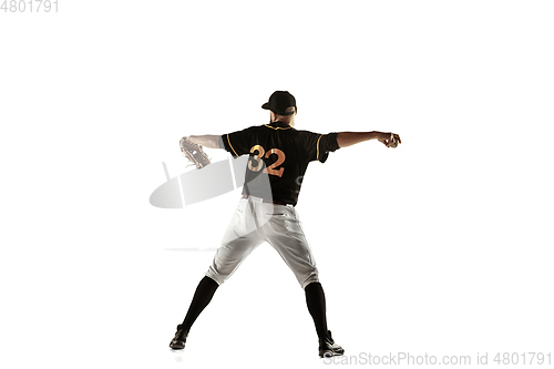 Image of Baseball player, pitcher in a black uniform practicing on a white background.