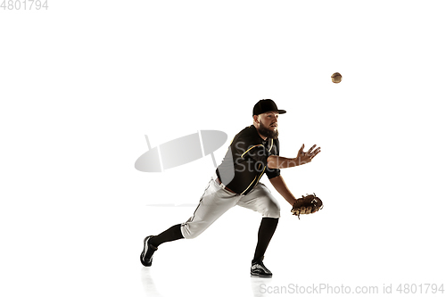 Image of Baseball player, pitcher in a black uniform practicing on a white background.