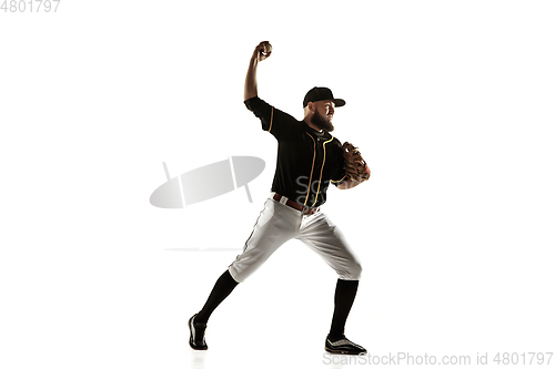 Image of Baseball player, pitcher in a black uniform practicing on a white background.