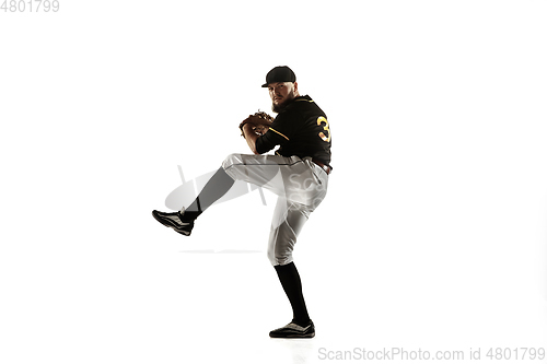 Image of Baseball player, pitcher in a black uniform practicing on a white background.