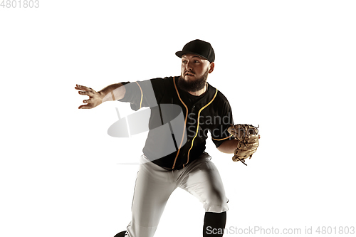 Image of Baseball player, pitcher in a black uniform practicing on a white background.