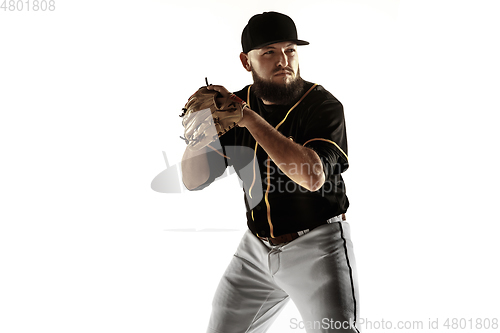 Image of Baseball player, pitcher in a black uniform practicing on a white background.