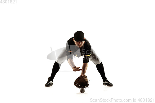 Image of Baseball player, pitcher in a black uniform practicing on a white background.