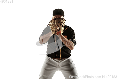 Image of Baseball player, pitcher in a black uniform practicing on a white background.