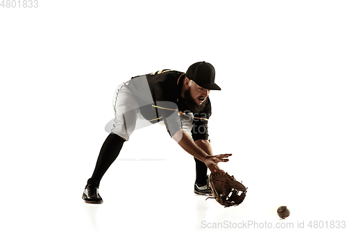 Image of Baseball player, pitcher in a black uniform practicing on a white background.