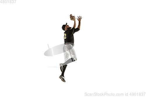 Image of Baseball player, pitcher in a black uniform practicing on a white background.