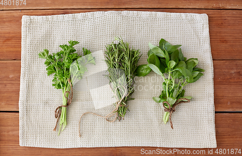 Image of greens, spices or medicinal herbs on towel