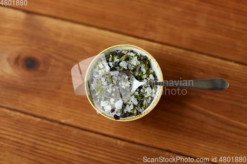 Image of close up of flavored sea salt in bowl with spoon