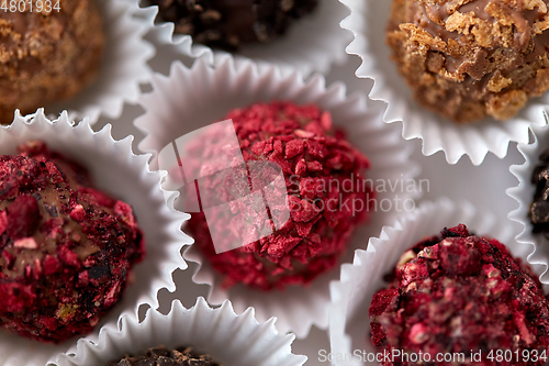 Image of close up of different candies in paper cups