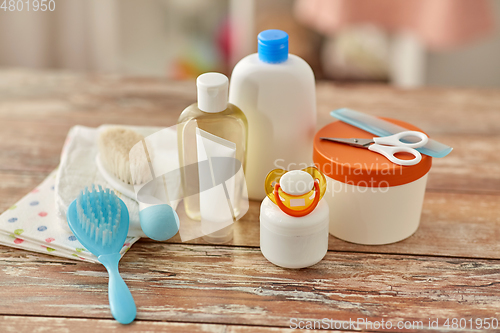 Image of baby accessories for bathing on wooden table