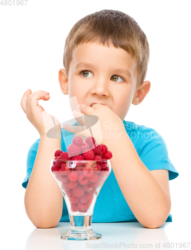 Image of Little boy with raspberries