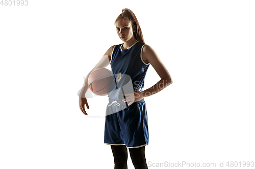 Image of Young caucasian female basketball player against white studio background