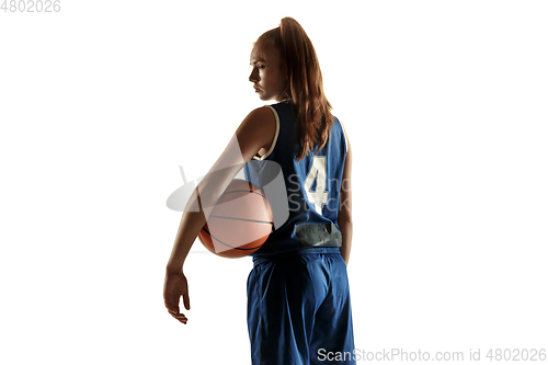 Image of Young caucasian female basketball player against white studio background