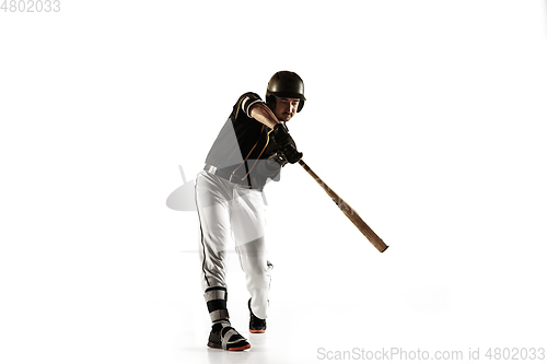 Image of Baseball player, pitcher in a black uniform practicing on a white background.