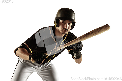 Image of Baseball player, pitcher in a black uniform practicing on a white background.