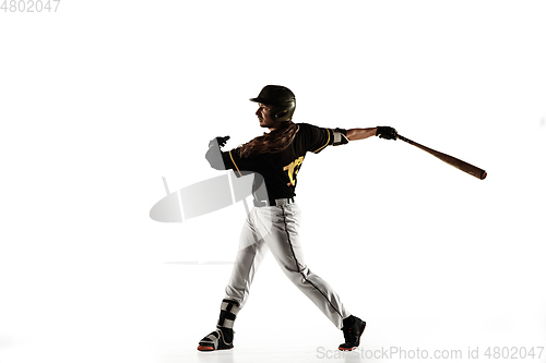 Image of Baseball player, pitcher in a black uniform practicing on a white background.