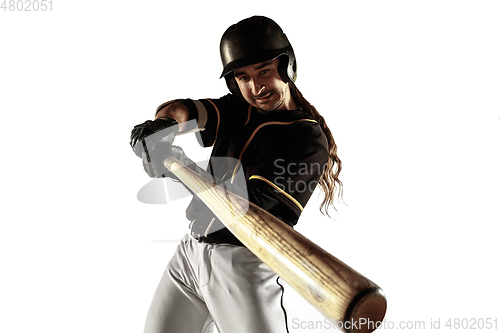 Image of Baseball player, pitcher in a black uniform practicing on a white background.