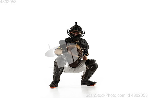 Image of Baseball player, pitcher in a black uniform practicing on a white background.