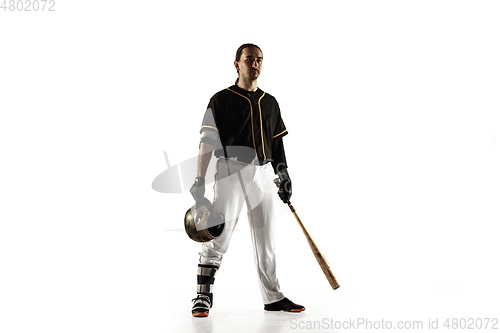 Image of Baseball player, pitcher in a black uniform practicing on a white background.