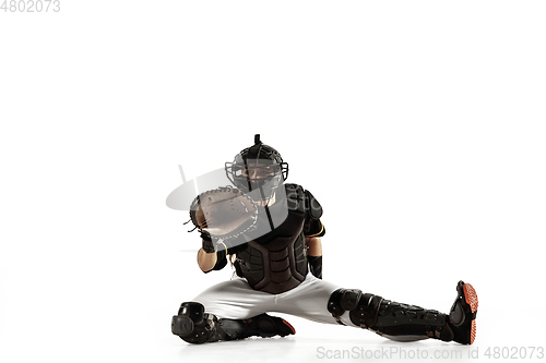 Image of Baseball player, pitcher in a black uniform practicing on a white background.