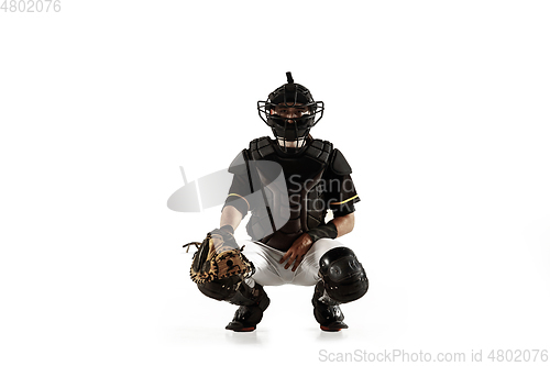 Image of Baseball player, pitcher in a black uniform practicing on a white background.