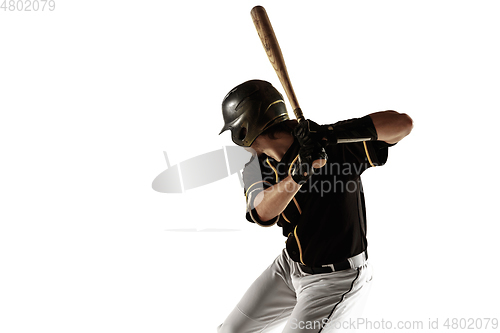 Image of Baseball player, pitcher in a black uniform practicing on a white background.