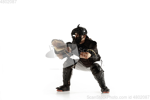 Image of Baseball player, pitcher in a black uniform practicing on a white background.