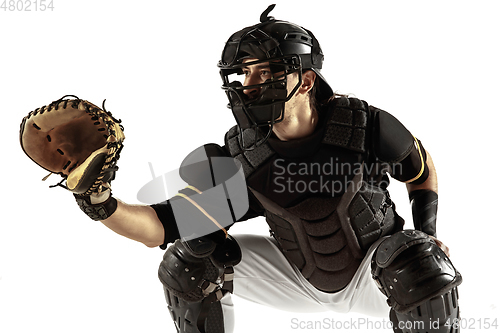 Image of Baseball player, pitcher in a black uniform practicing on a white background.