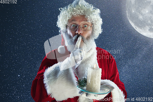 Image of Emotional Santa Claus congratulating with New Year and Christmas