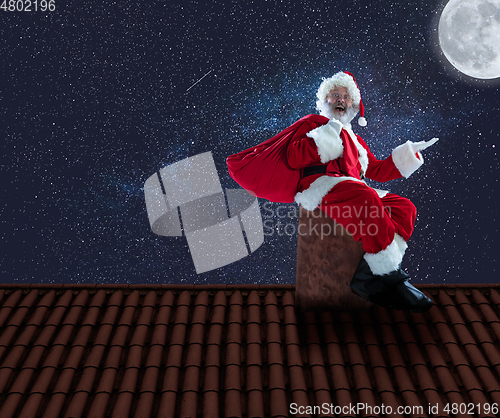 Image of Emotional Santa Claus congratulating with New Year and Christmas