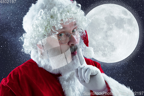 Image of Emotional Santa Claus congratulating with New Year and Christmas