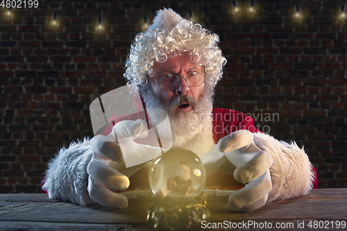 Image of Emotional Santa Claus congratulating with New Year and Christmas