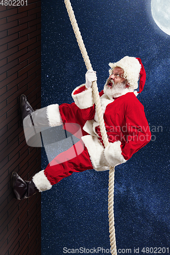Image of Emotional Santa Claus congratulating with New Year and Christmas