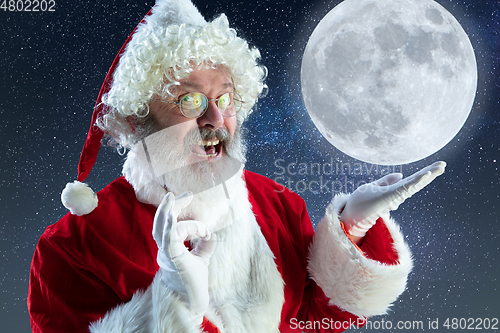 Image of Emotional Santa Claus congratulating with New Year and Christmas