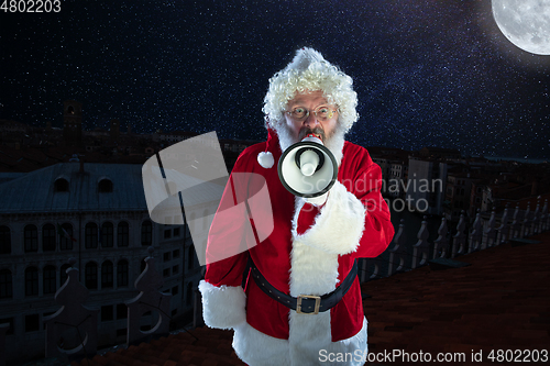 Image of Emotional Santa Claus congratulating with New Year and Christmas