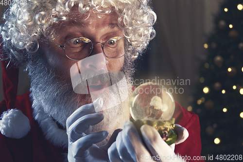 Image of Emotional Santa Claus congratulating with New Year and Christmas