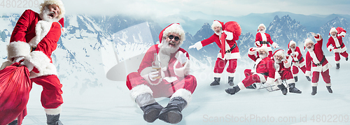 Image of Emotional Santa Clauses greeting with New Year and Christmas, copyspace